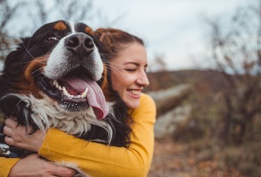 Young woman with dog outside